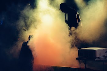 Man Holding Microphone at the Stage