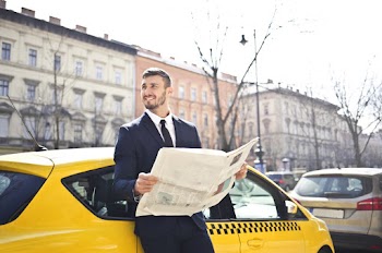Man Holding Newspaper
