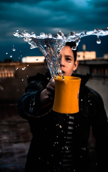 Man Holding Orange Mug