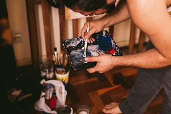 Man Holding Paint Brush