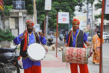Man Holding Percussion Instrument