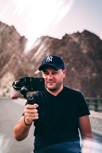 Man Holding Phone With Stabilizer