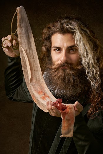 Man Holding Piece Of Cloth