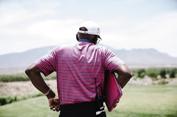 Man Holding Pink Case
