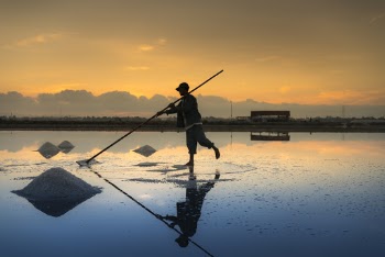 Man Holding Pole