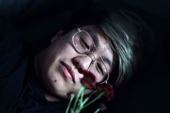 Man Holding Red-petaled Flowers