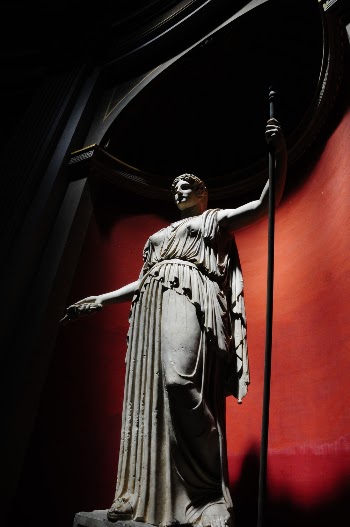 Man Holding Rod Statue