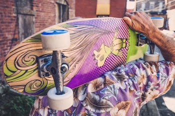Man Holding Skateboard Free Photo 