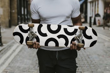 Man holding skateboard mockup, editable | Free PSD Mockup - rawpixel