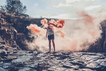 Man Holding Smoke Bomb