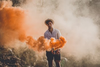 Man Holding Smoke Bomb