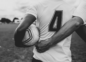 Man Holding Soccer Ball