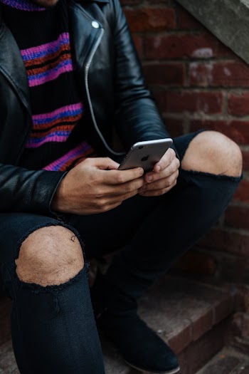 Man Holding Space Grey Iphone 