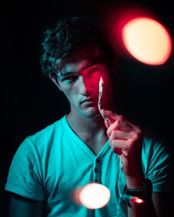 Man Holding String Light