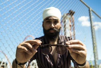 Man Holding Sunglasses