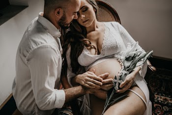 Man Holding the Tummy of the Pregnant Woman