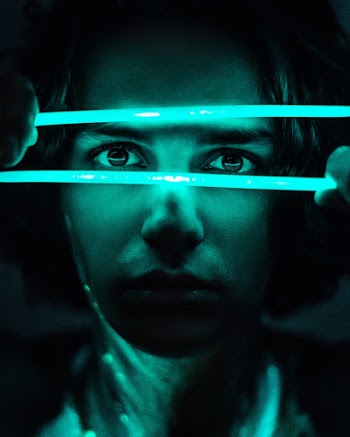 man Holding Two Neon Light Sticks