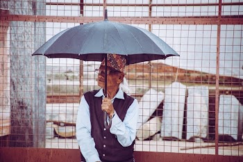 Man Holding Umbrella