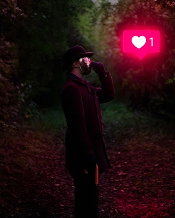 Man Holding Umbrella Inside Forest While Facing Heart Icon