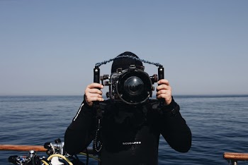 Man Holding Underwater Camera