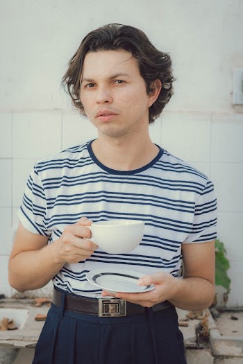 Man Holding White Ceramic Cup