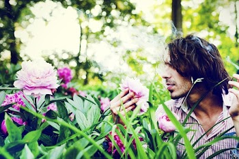 Man Holding White Flower
