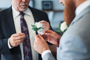 Man Holding White Flower
