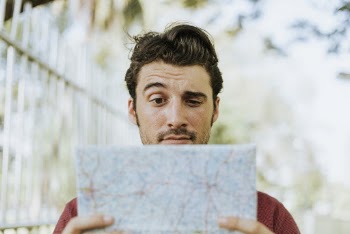 Man Holding White Paper