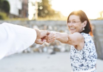 Man Holding Woman's Hand