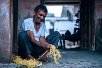 man holding yellow rope outdoor