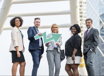 Man Holding Zigzag Arrow Between Four People