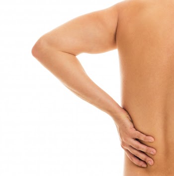 Man holds his back due to pain Free Photo