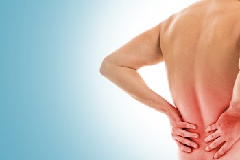 Man holds his back due to pain Free Photo