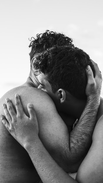 Man Hugging Another Man