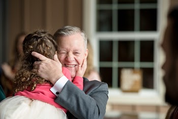 Man Hugging Girl Inside Room