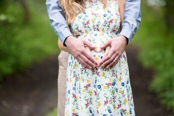 Man Hugging Pregnant Woman from Behind