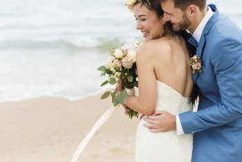 Man Hugging Woman Near Seashore