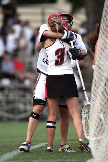 Man Hugging Woman on Field