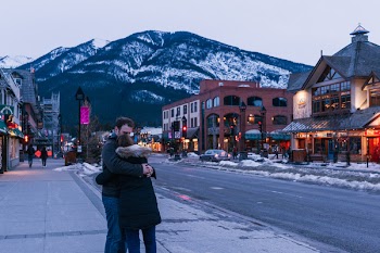 Man Hugging Woman on Street