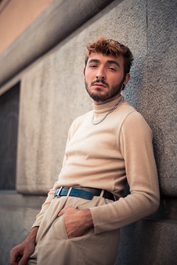 Man In A Beige Turtle Neck Sweater And Pants