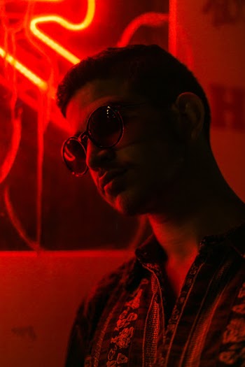 Man in a red-lit room