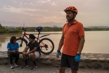 Man in an Orange Bike Helmet
