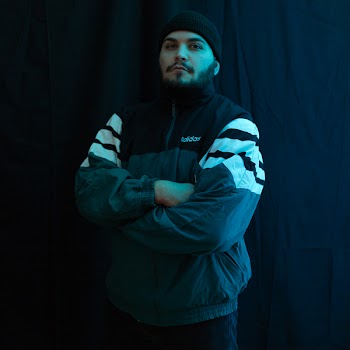 Man in Black Adidas Jacket and Knit Cap