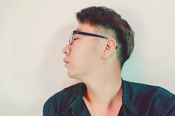 Man in Black Collared Shirt With Black Frame Eyeglasses