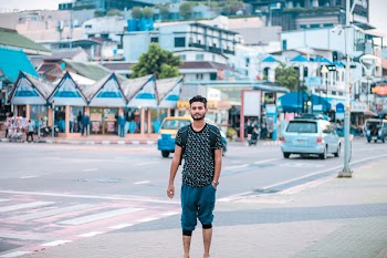 Man In Black Crew-neck Shirt And Blue Pants