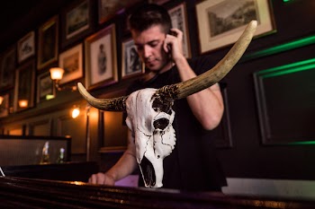 Man in Black Crew-neck Shirt Holding Smartphone