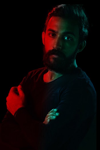 Man in Black Crew-neck Sweatshirt Posing for a Photo