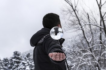 Man in Black Hoodie during Snow Weather at Daytime