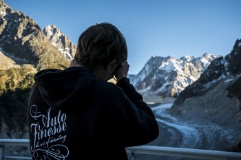 Man in Black Hoodie Holding Camera