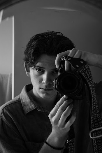 Man in Black Jacket Holding Black Nikon Dslr Camera · Free Stock Photo
